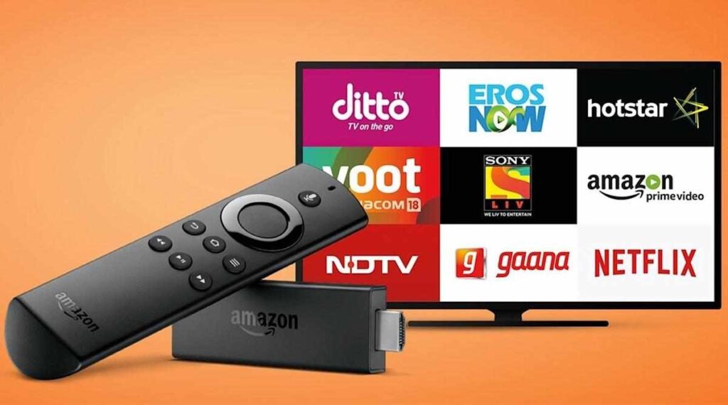 An image of an Amazon **Firestick** streaming device and its remote control in the foreground. In the background, a TV screen displays the logos of various streaming services like Netflix, Amazon Prime Video, Hotstar, and Voot. The image illustrates the context for the question: **Why Is My Firestick Buffering**?